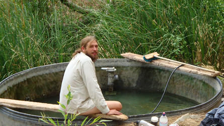 Andy in the cattle trough while its filling (Willett)
